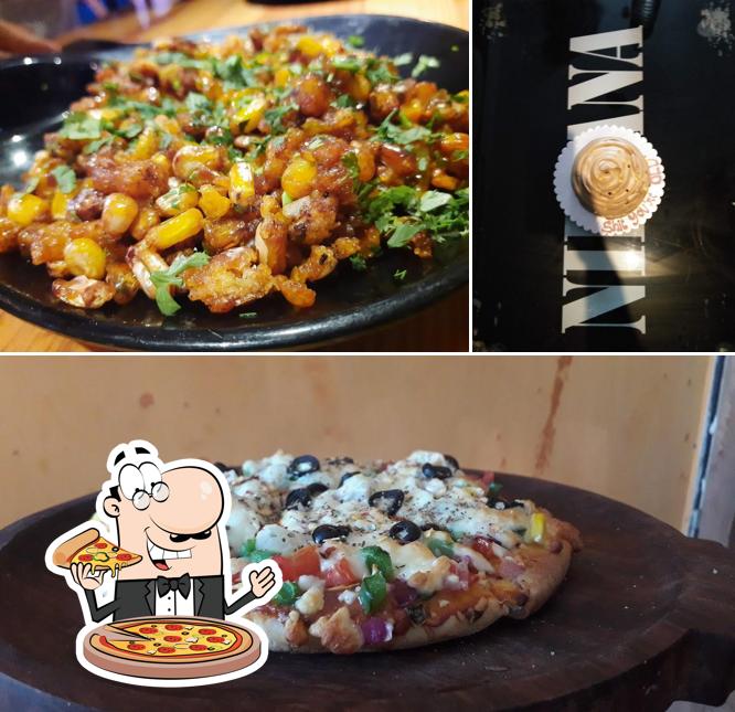 Pick pizza at NIRVANA CAFE&ROOFTOP
