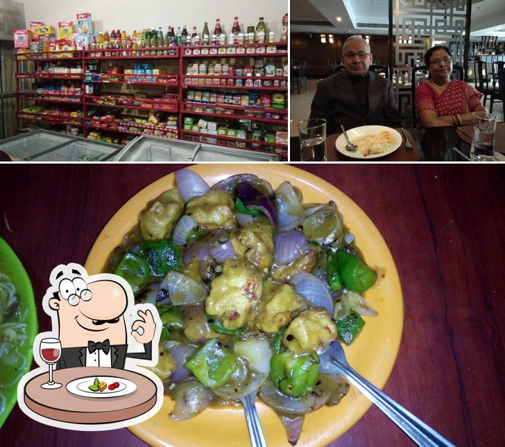 This is the picture depicting food and dining table at Exer Club