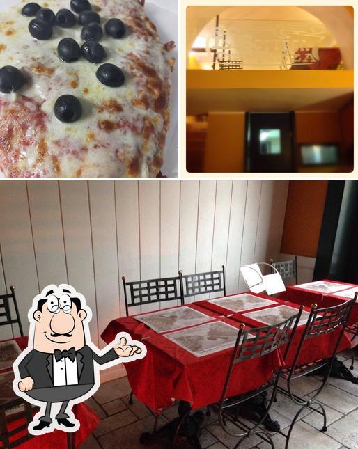 Questa è la foto che presenta la interni e pizza di Roma in Teglia