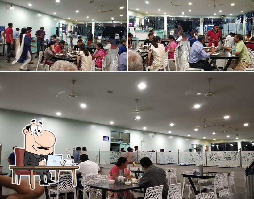 Take a seat at one of the tables at UPADHYA VEG