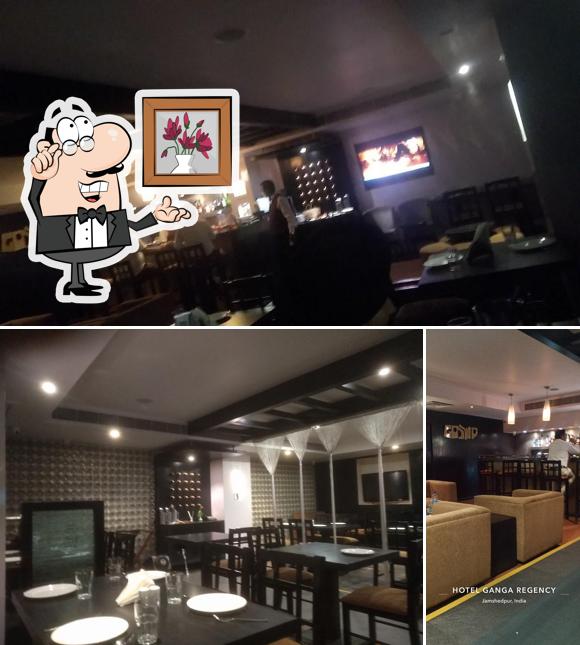 Take a seat at one of the tables at Gossip Bar n restaurant