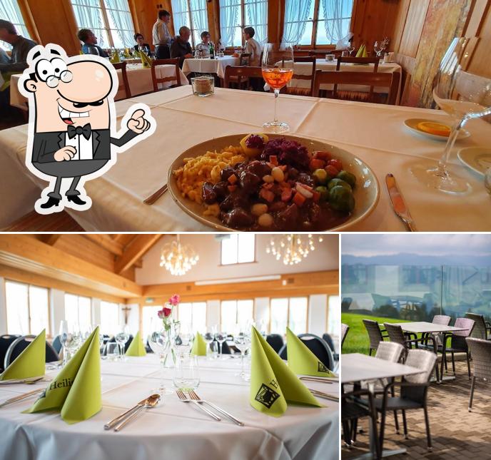 Siediti a un tavolo di Hotel Kurhaus Heiligkreuz