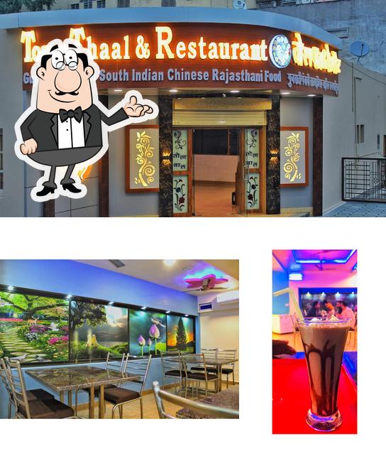 Check out the picture showing interior and beverage at Toran Thaal & Restaurant