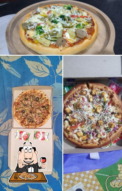 Try out pizza at Pizza Palace