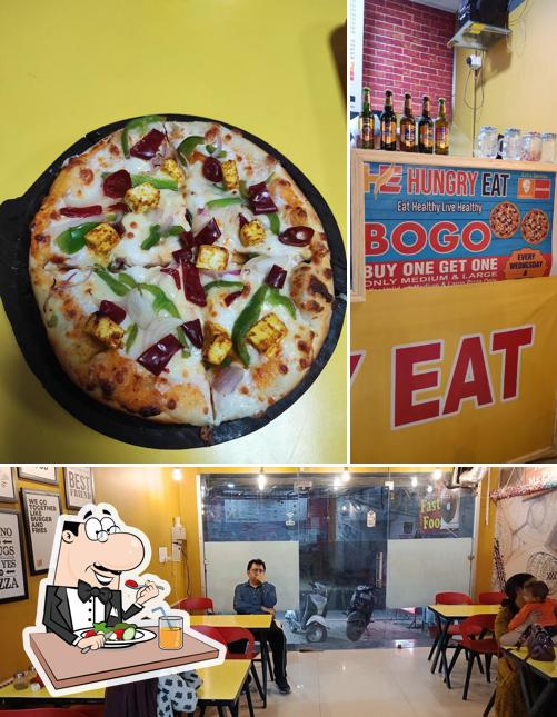 Take a look at the image displaying food and interior at HUNGRY EAT's