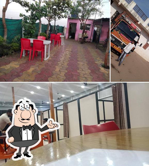 Take a seat at one of the tables at Hotel Manpasand