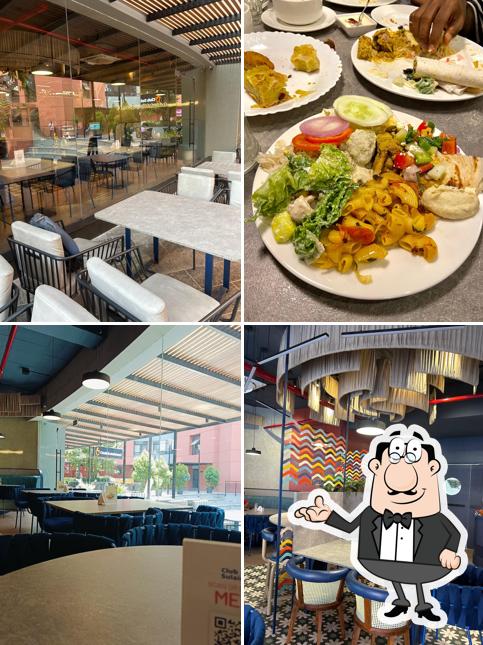 Take a seat at one of the tables at Club Sulaimani HiLite Business Park