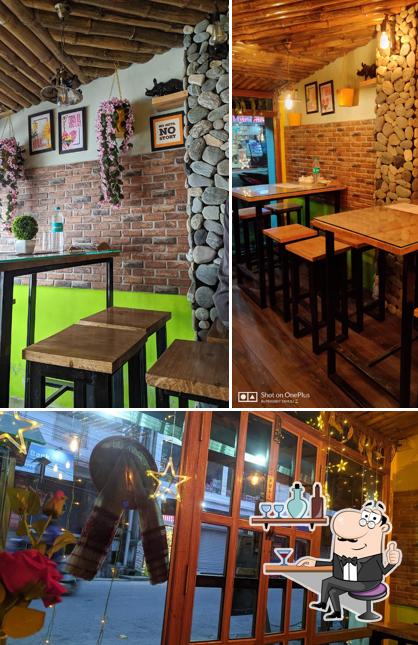 Take a seat at one of the tables at Le Green Cafe