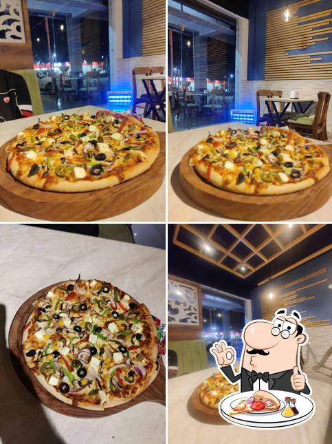 Get pizza at Canadian Pizza & Burger Malout