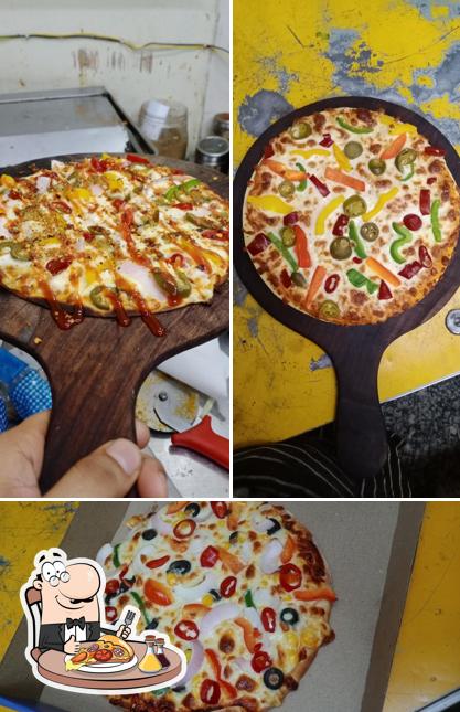 Pick pizza at The Mud Shakes Kamla nagar