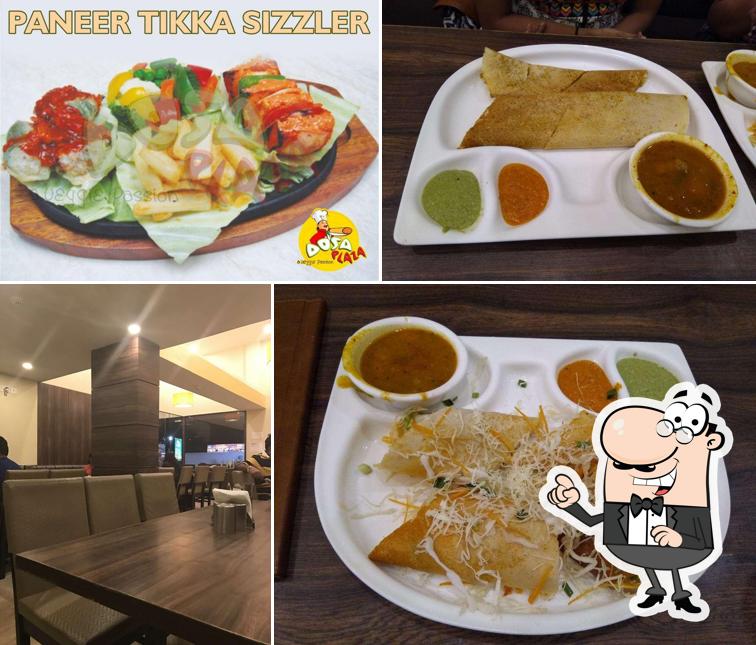 Take a seat at one of the tables at Dosa Plaza