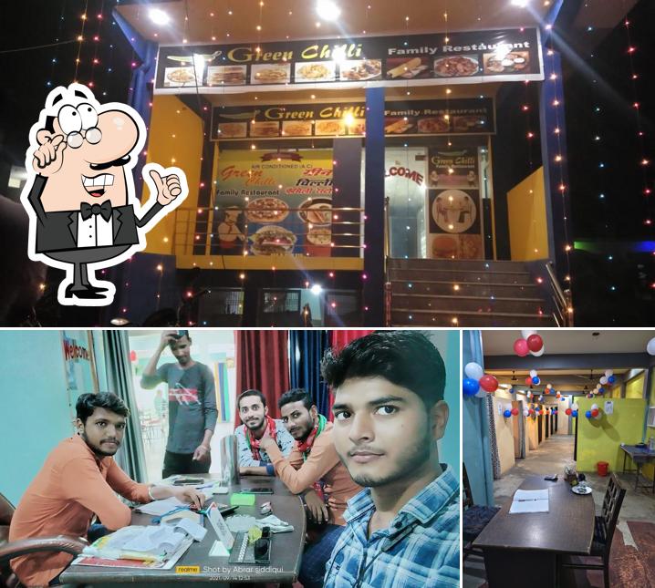 Take a seat at one of the tables at Green Chilli Family Restaurant