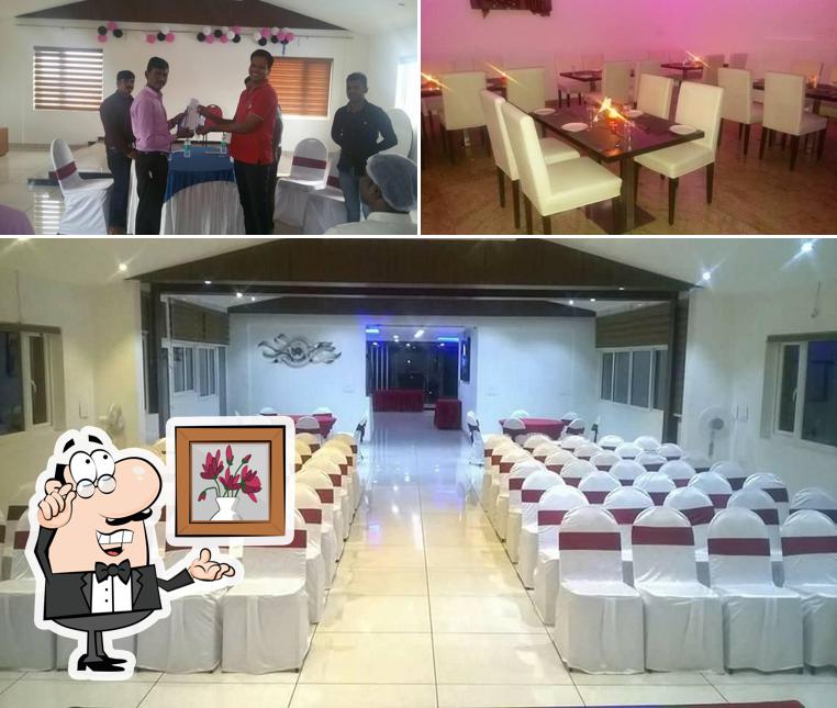 Take a seat at one of the tables at Swadishta Restaurant ( CRYSTAL INN) STAY & DINE-Vegetarian Hotel In Chickmagalur