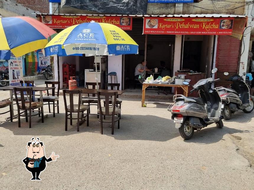 Enjoy a drink at Kartar's Pehalwan Kulcha