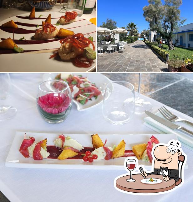 Questa è la foto che raffigura la cibo e esterno di Riva di Palo Resort