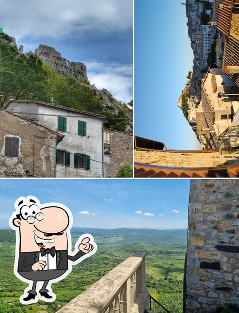 Puoi goderti l'aria fresca da seduto all'esterno di Tolfa Piazza Vecchia