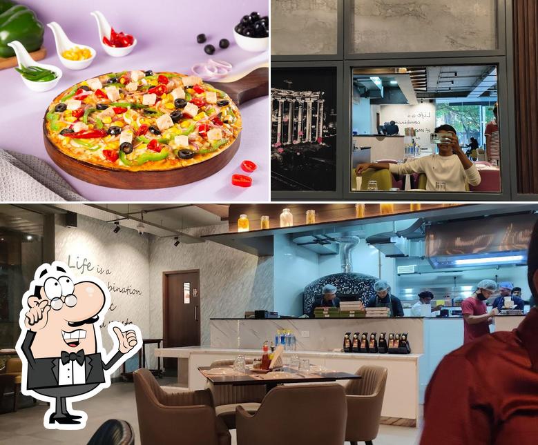 The photo of interior and pizza at Pasta Street - JP Nagar