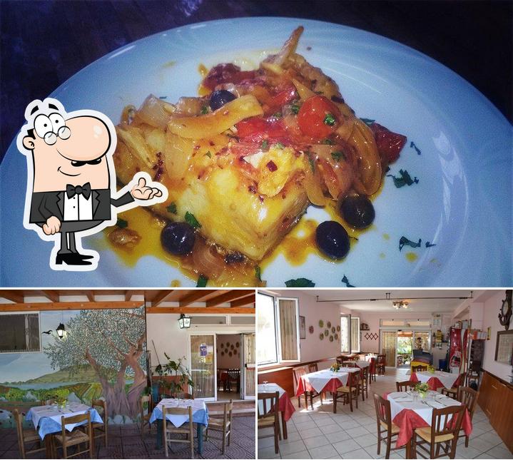 La immagine di interni e frutti di mare da Trattoria Dell'ulivo