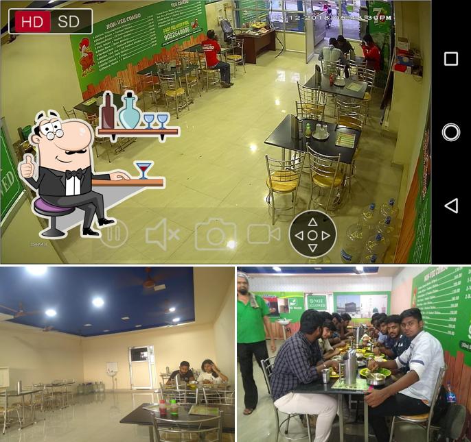 Take a seat at one of the tables at AL-TAJ BIRIYANI