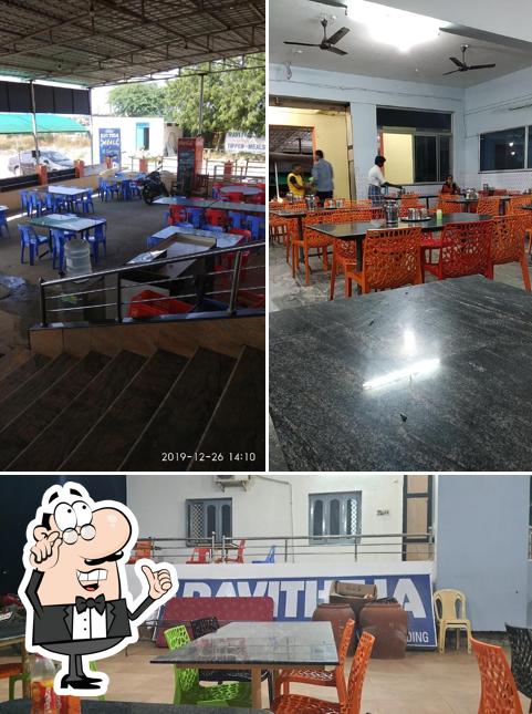 Take a seat at one of the tables at Hotel Ravi Theja