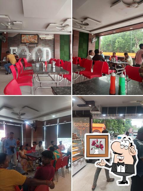 Take a seat at one of the tables at Hotel Manpasand