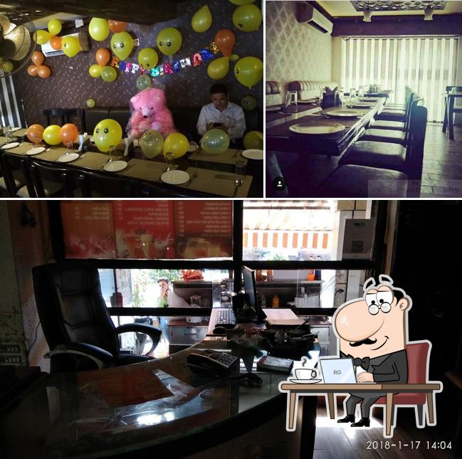 Take a seat at one of the tables at CHILLI FLAKES RESTAURANT