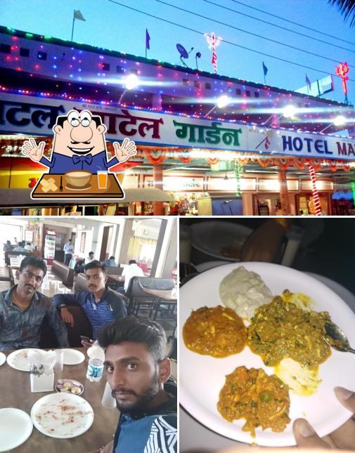 This is the picture depicting food and dining table at HOTEL MATEL GARDEN