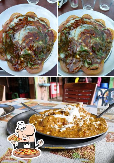Get pizza at Hotel Susuma Restaurant Cum Bar