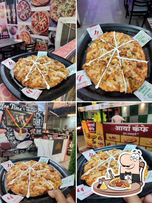 Order pizza at Arya's cafe & Hotel
