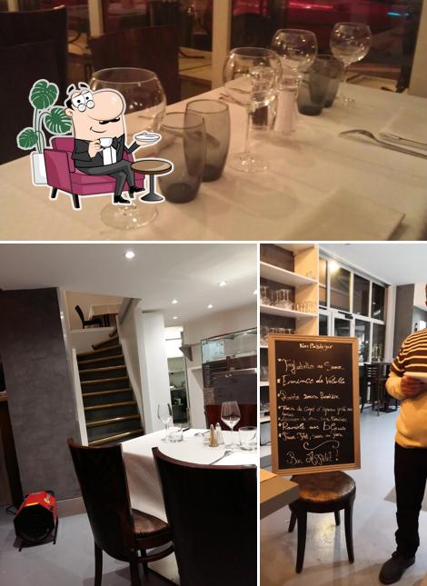Parmi les différentes choses de la intérieur et la tableau noir, une personne peut trouver sur Restaurant Pizzeria Chez Pierre