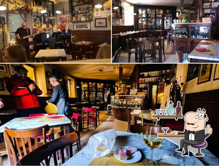 La immagine di interni e tavolo da pranzo da Bottega del Vino