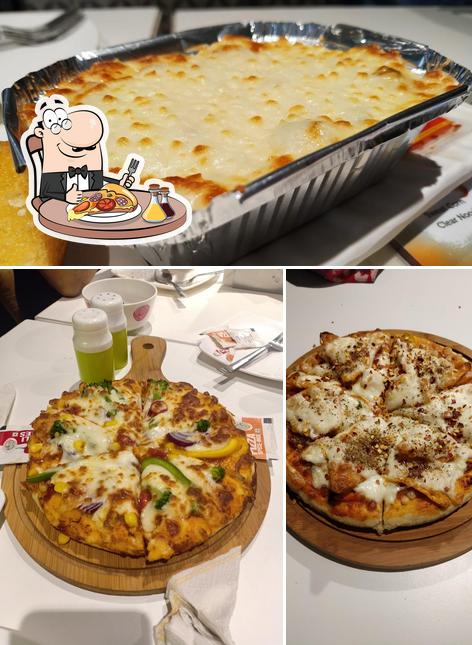 Try out pizza at The Bang Onn Cafe