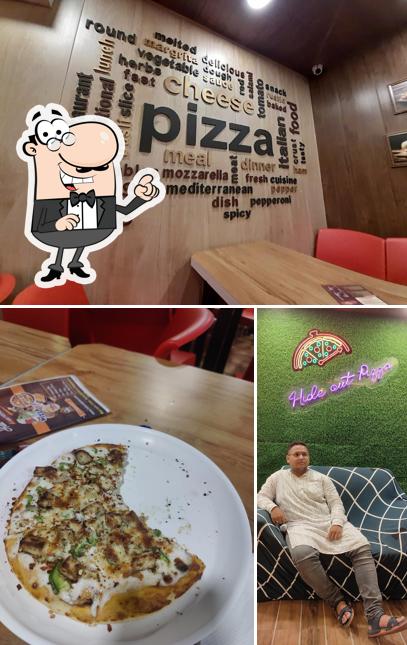 This is the image depicting interior and food at hide out pizza