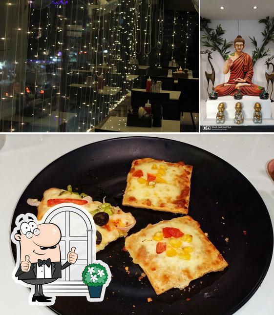 The picture of exterior and pizza at PIZZA POINT