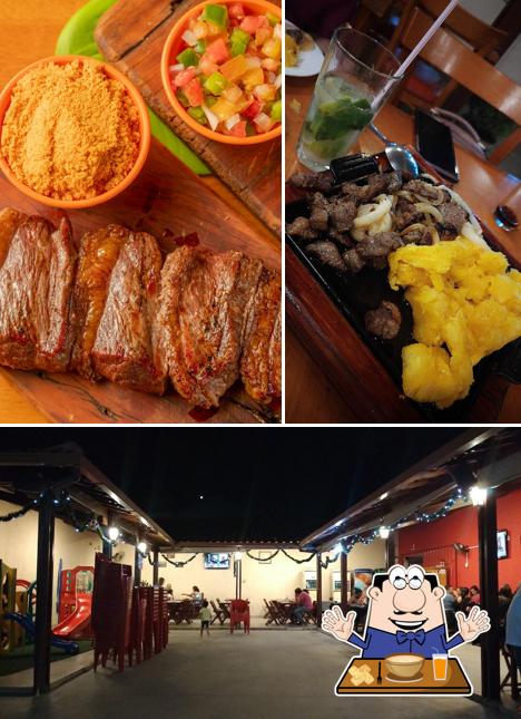 Esta é a imagem apresentando comida e interior no Espeto do Manoel II