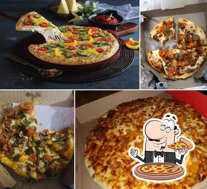 Try out pizza at Domino's Pizza Uttam Palace, Sapru Marg