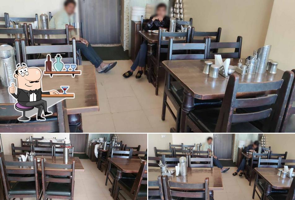 Take a seat at one of the tables at Ganesh Restaurant