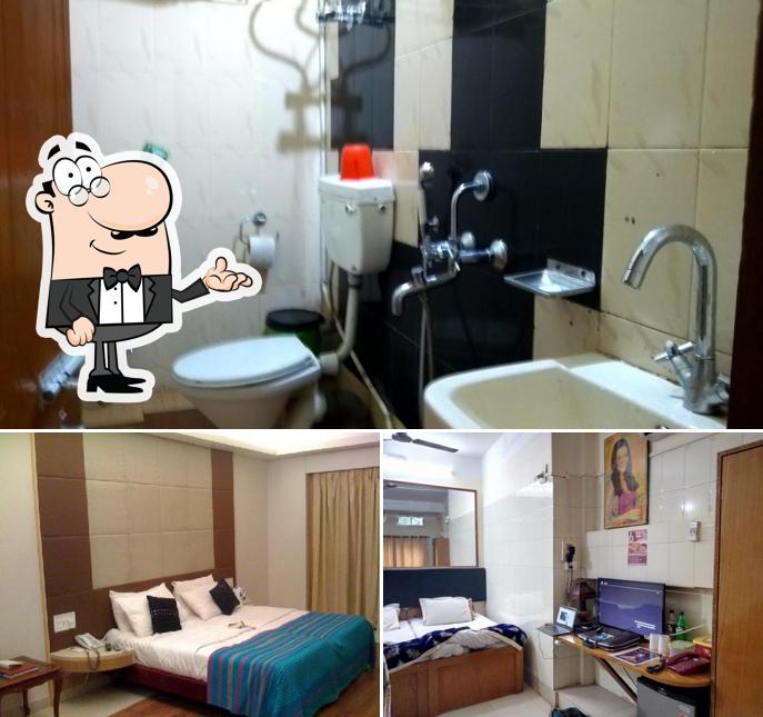 Take a seat at one of the tables at Parijat Hotel & Restaurant