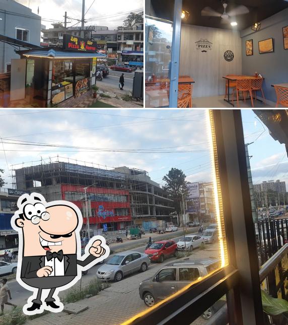 This is the photo showing exterior and interior at Pizza Heaven