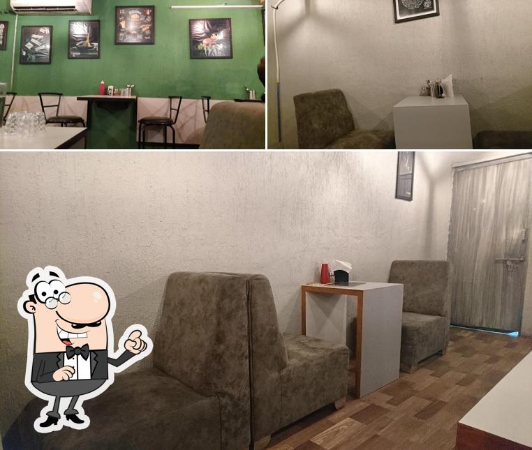 Take a seat at one of the tables at THE CUPS - AHD