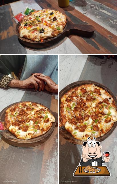 Get pizza at The Smugglers Cafe