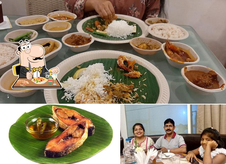 Check out the image displaying food and interior at Bhojohori Manna