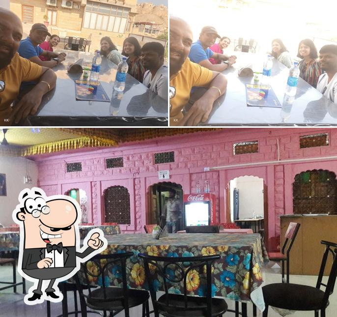 Take a seat at one of the tables at Kabab Corner Restaurant