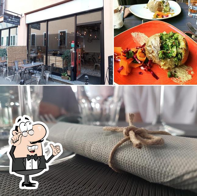 La immagine di interni e tavolo da pranzo da Ristorante The Factory Castellanza