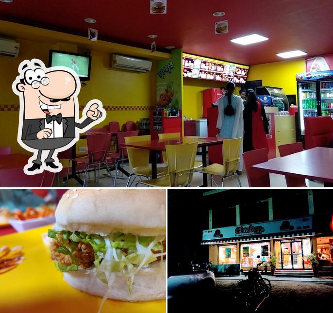 Check out the picture showing interior and burger at Chickin Fried Chicken