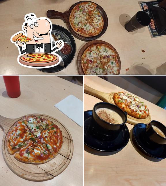 Get pizza at Tasty Treat Cafe Mahwa