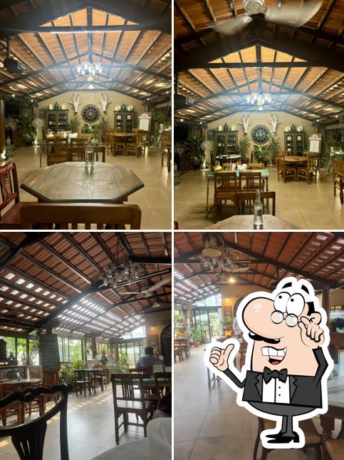 Take a seat at one of the tables at The Café at Saanchi - Authentic Persian Cuisine & Silk Route Aroma - Dining Experience