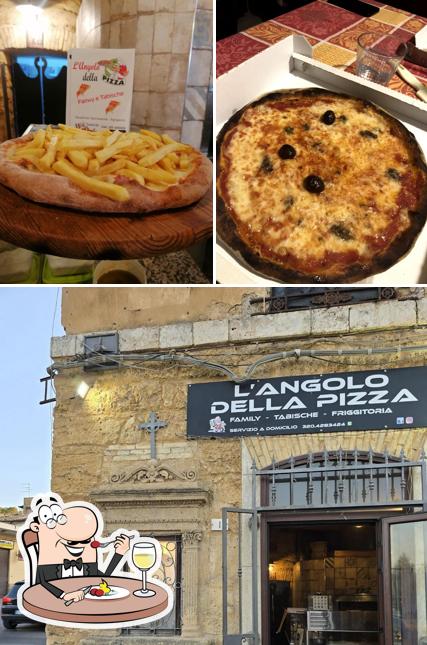Questa è la immagine che presenta la cibo e esterno di L'angolo della pizza