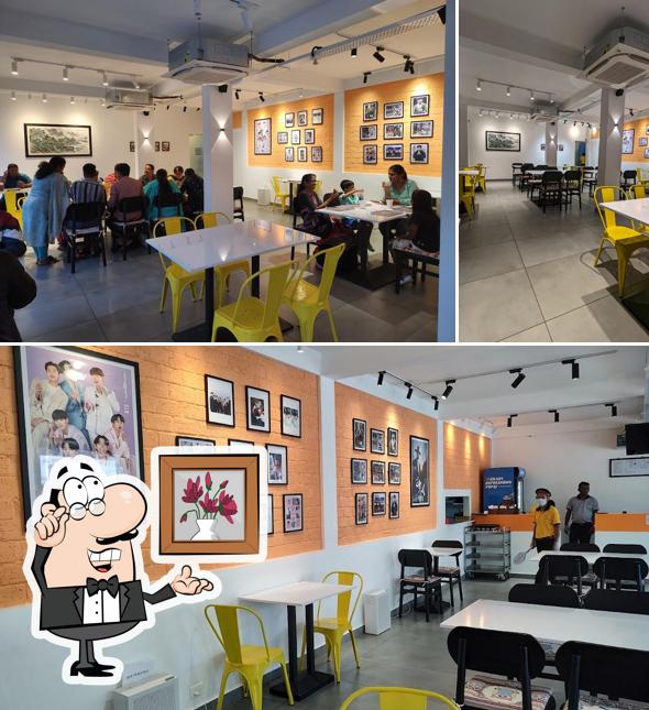 Take a seat at one of the tables at Mukbang Korean Restaurant & Bakery