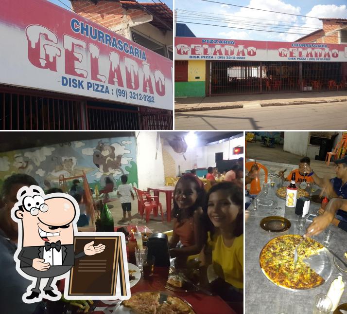 O Pizzaria e Churrascaria Geladão se destaca pelo exterior e mesa de jantar